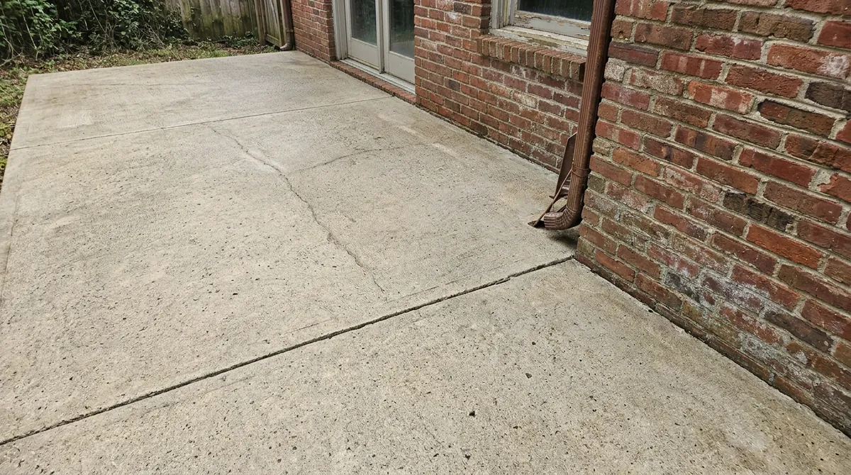 After: Pressure-Washed Clean | Music City Cleaner After: The same patio and brick wall, now pressure-washed clean and bright, same angle and same light